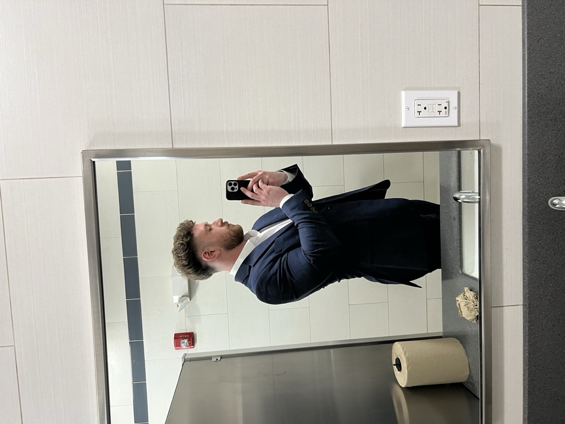 Ryan in a full suit as a floor closer